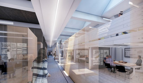Image of an office space with desks and monitors