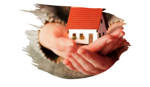 Hands holding a house