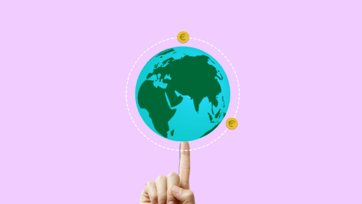 Finger holding up image of the world against purple background